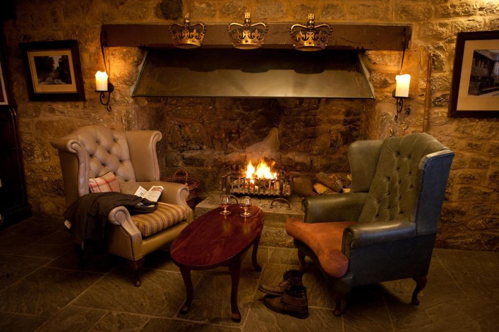 The Three Crowns Hotel Chagford Exterior photo The fireplace in the bar